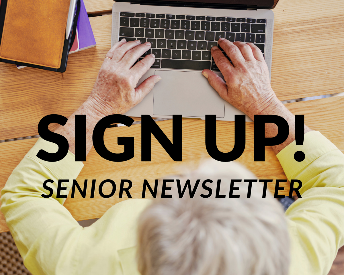 older lady typing on her laptop